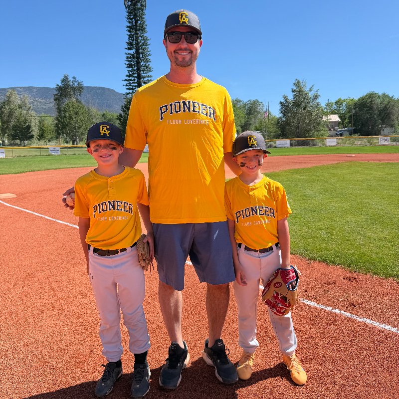 Brant with his sons playing baseball