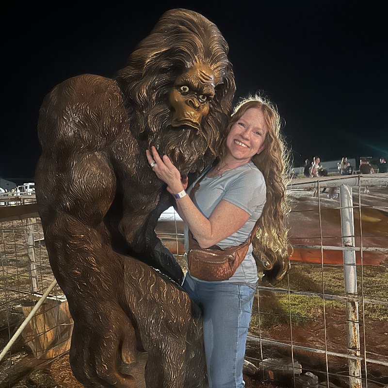 Kristy posing with a Big Foot mascot