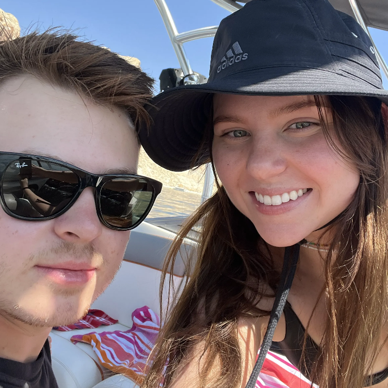 Cory and friend on a boat