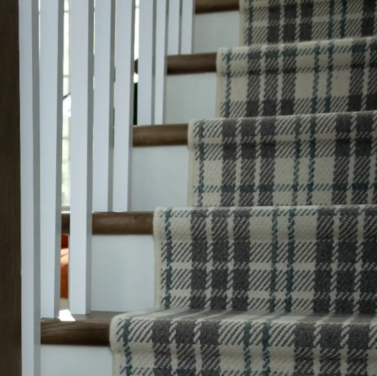 Plaid Karastan Black Label carpet as a stair runner