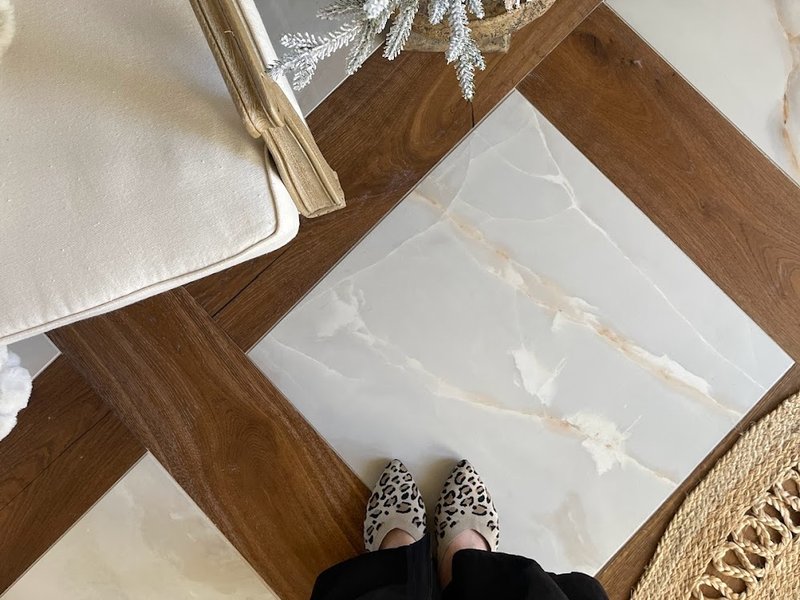 Unique marble tile and hardwood floor by Pioneer Floor Coverings