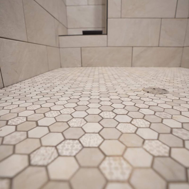 Honeycomb patterned tile installed on a shower floor