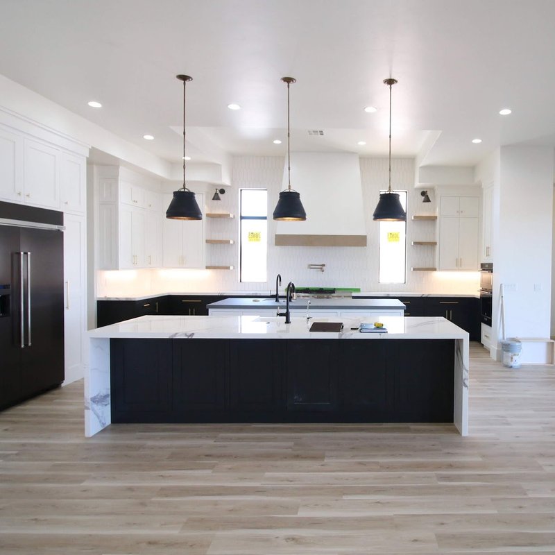 White kitchen cabinets and light LVP flooring