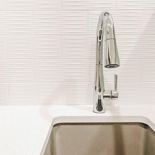 Textured tile backsplash at 'Clear Glenn' from Pioneer Floor Coverings & Design