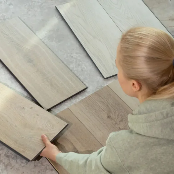 Homeowner looking at eco-friendly flooring samples